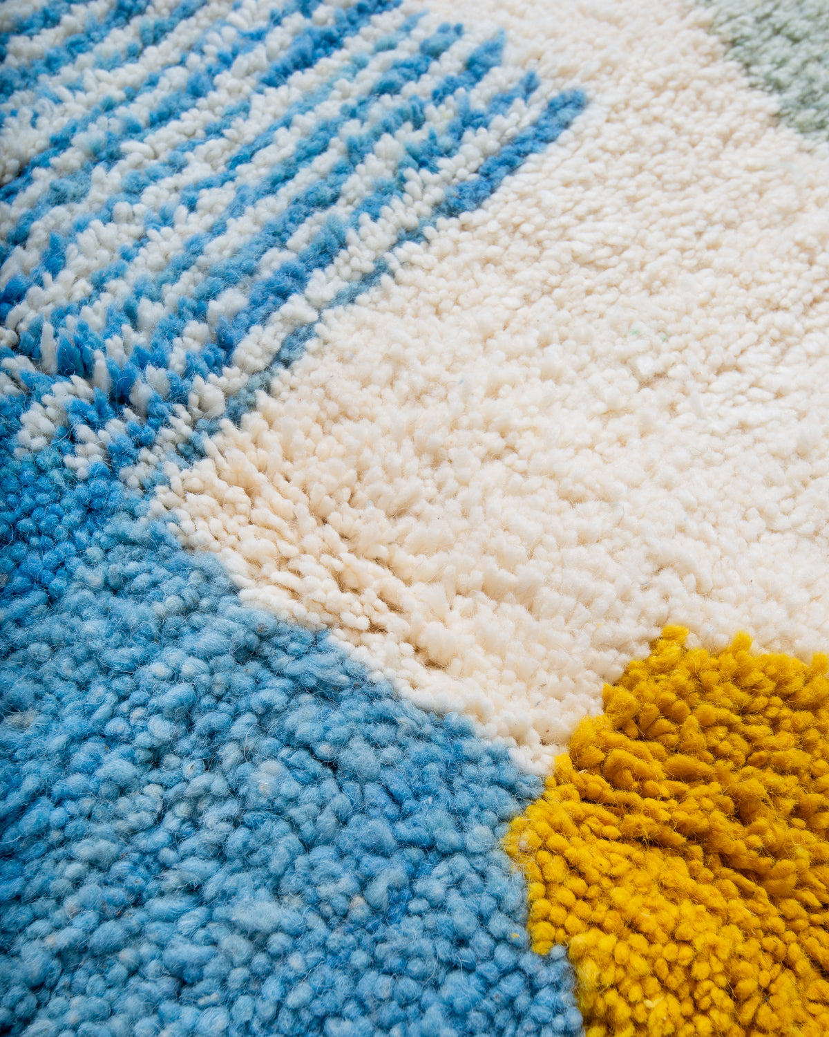 Modern, designer, handcrafted Berber rug from Morocco. Beniourain carpet with beautiful colours and patterns and fluffy wool texture.